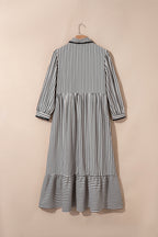 Black stripe maxi dress by Dear-Lover with scallop trim, shirt collar, half button, 3/4 sleeves, made of polyester and viscose.