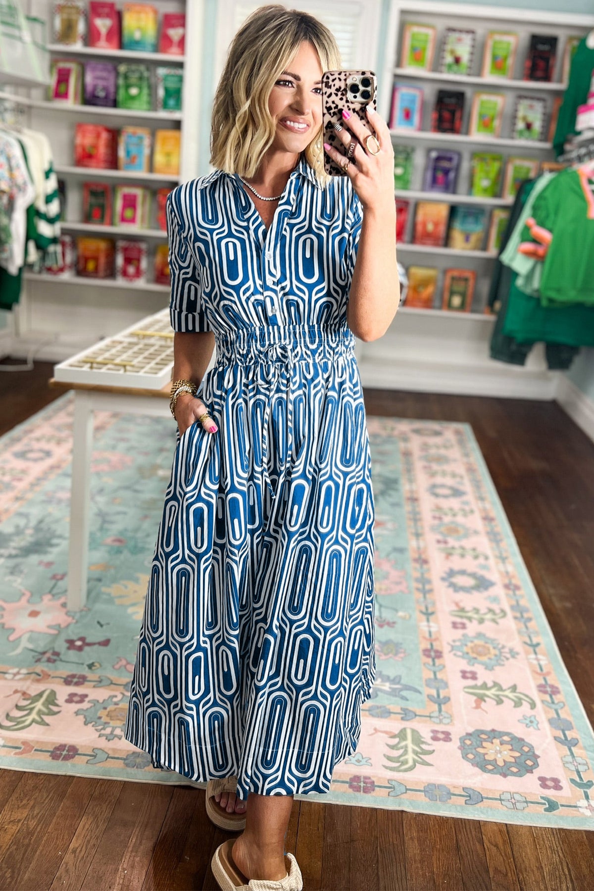 Blue geometric print maxi dress by Dear-Lover with short sleeves, drawstring waist, and shirt collar in cotton and viscose blend.