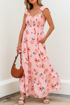 Pink floral maxi dress by Dear-Lover with V-neck, smocked waist, ruffle hem, and long flowing design in polyester fabric.