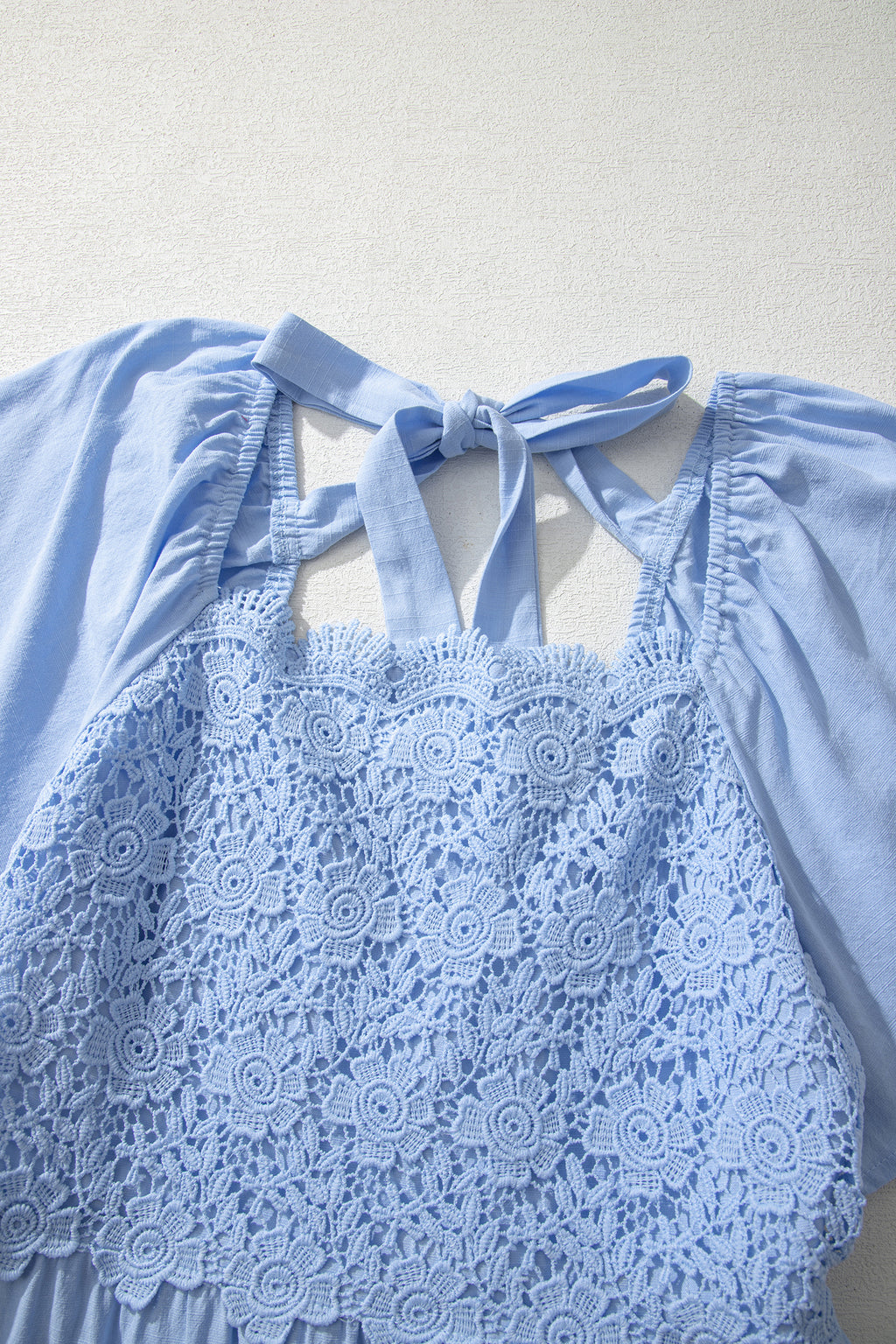 Beau Blue flowy short sleeve midi dress with lace detail, square neckline, and tiered design, made of cotton and viscose fabric.