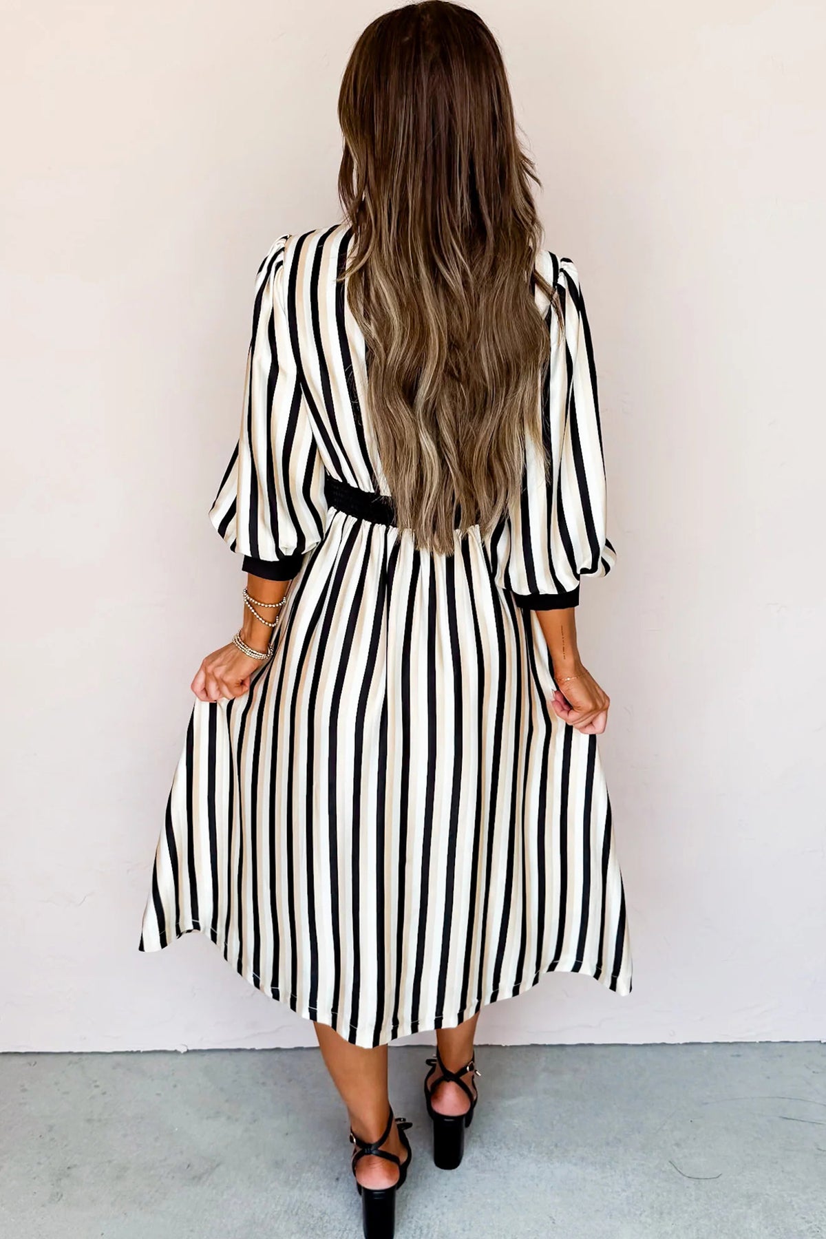 Black stripe midi dress by Dear-Lover with 3/4 puff sleeves, button-down shirt style, made from 100% viscose fabric.