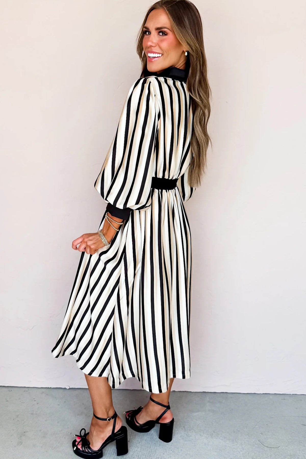 Black stripe midi dress with puff 3/4 sleeves, button-down style, made from viscose fabric, by Dear-Lover.