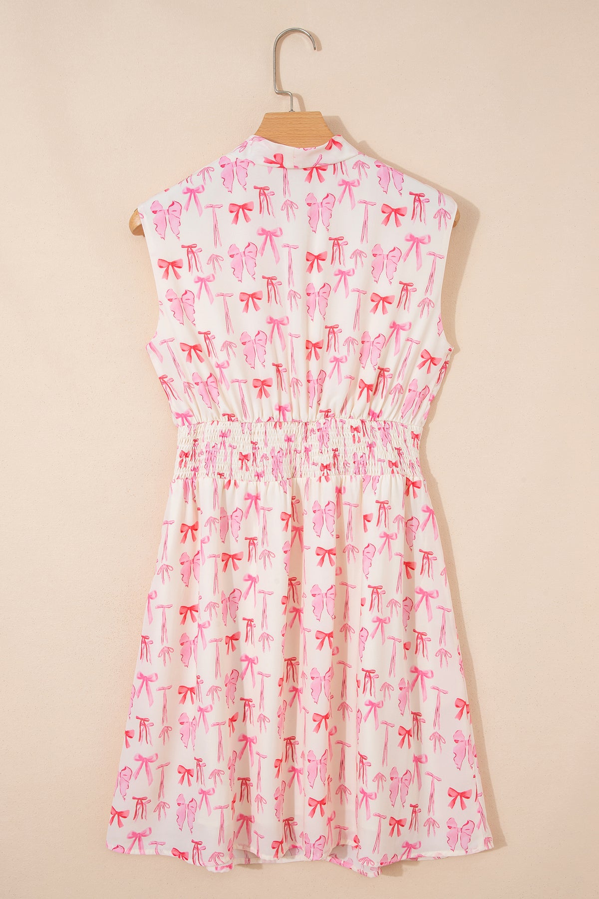 Pink sleeveless mini dress with full zip, cinched waist, and bow detail by Dear-Lover, perfect for stylish summer wear.