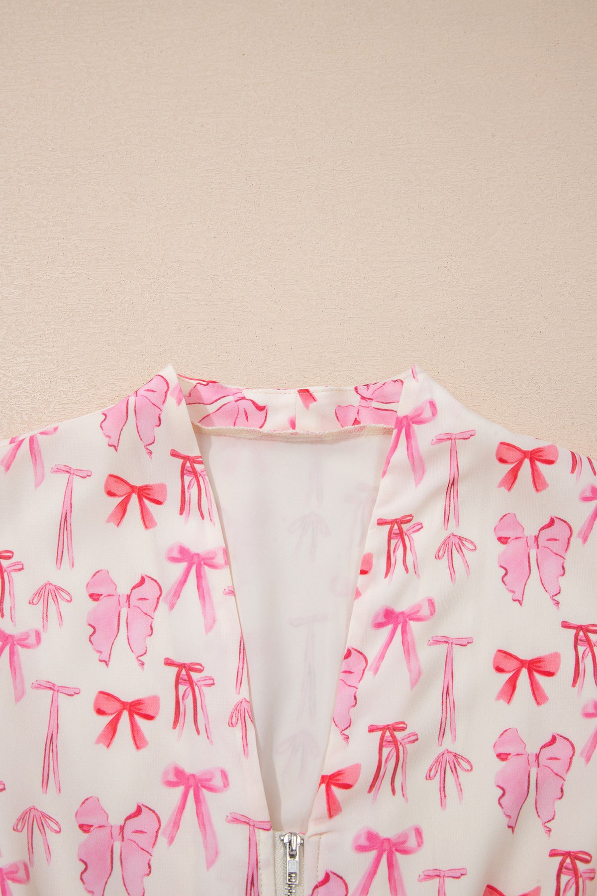 Pink sleeveless mini dress with full zip, cinched waist, and bow detail from Dear-Lover, made of lightweight polyester.