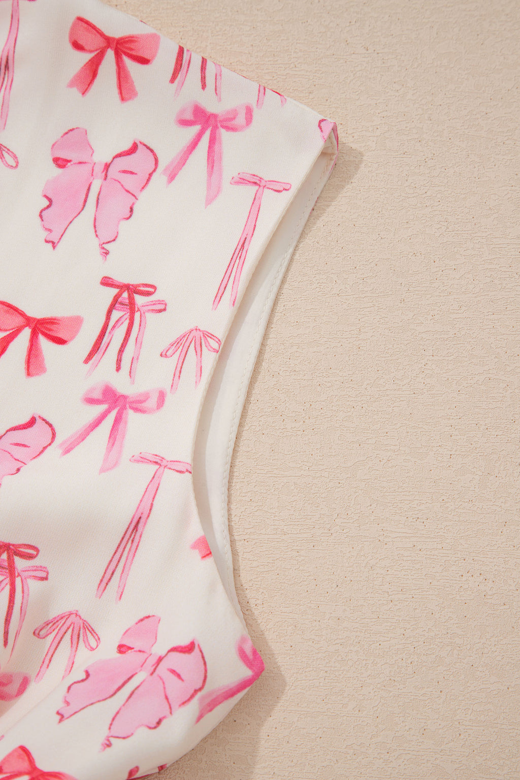 Pink sleeveless mini dress with full zip, cinched waist, and bow detail from Dear-Lover, made of lightweight polyester fabric.