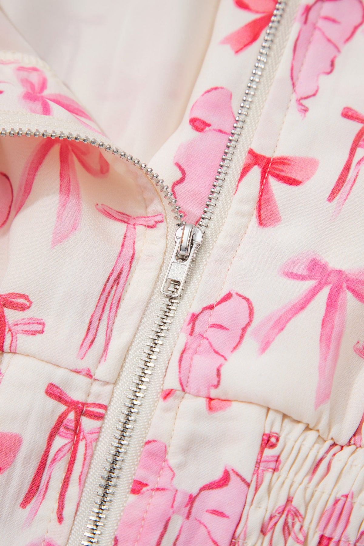 Pink sleeveless mini dress with a full zipper, cinched waist, and bow detail, by Dear-Lover Dropshipping, made of lightweight polyester.