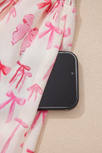 Pink sleeveless mini dress with a full zip, cinched waist, and bow detail from Dear-Lover, made of lightweight polyester fabric.