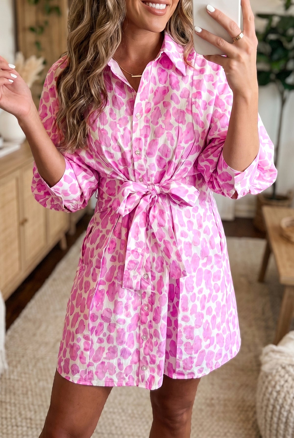 Pink abstract leopard print mini shirt dress with tie waist and puff sleeves by Dear-Lover, made of cotton and viscose fabric.