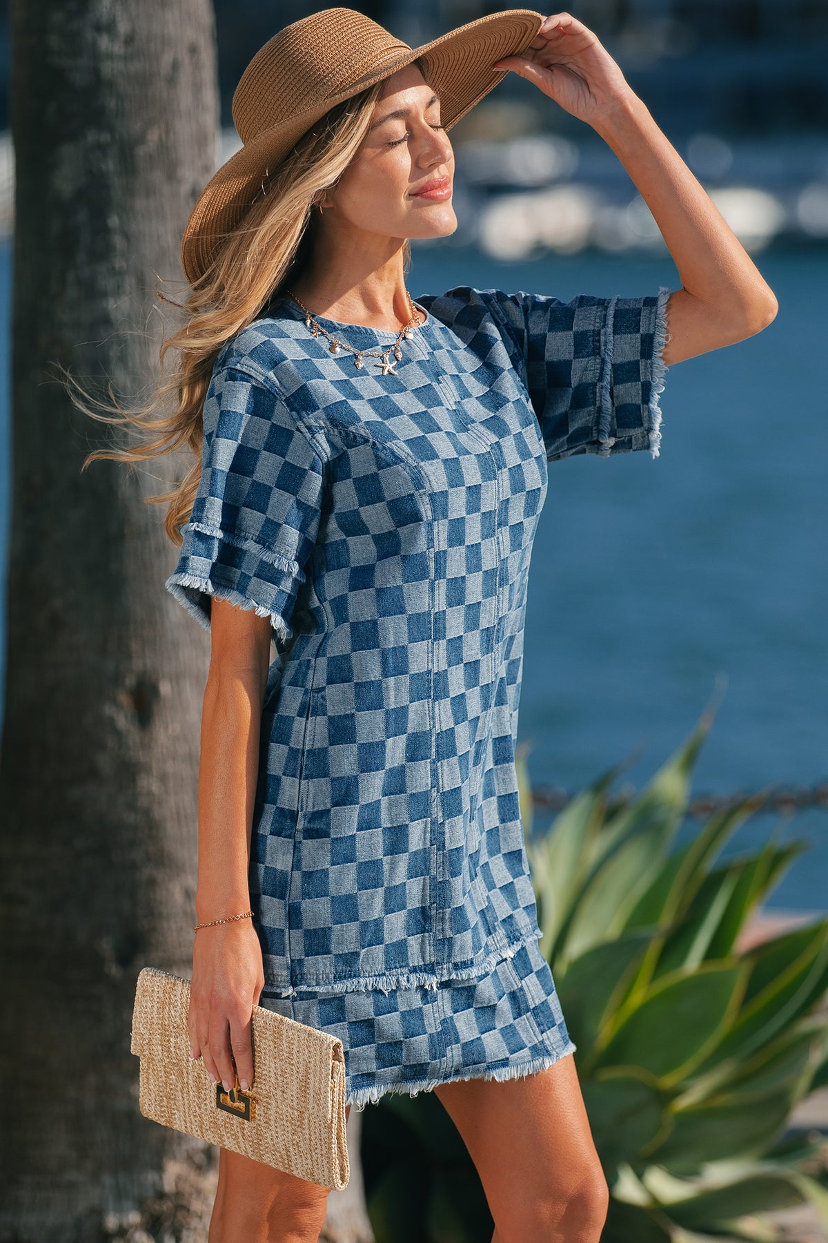 Sky blue checkered denim mini dress with frayed hem by Dear-Lover, featuring a casual, stylish design perfect for warm weather.