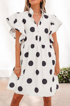 White polka dot print mini dress by Dear-Lover with short ruffled sleeves, half buttons, and a loose fit made of lightweight polyester.
