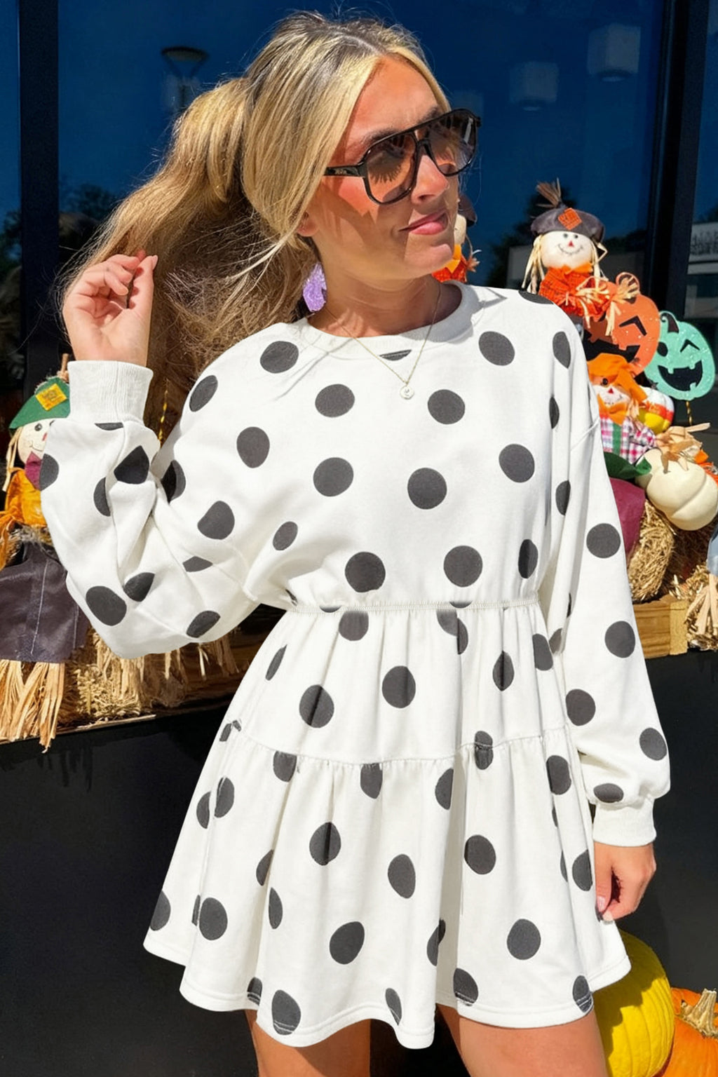 White polka dot printed long sleeve flared mini dress by Dear-Lover, featuring a fitted bodice and flowy skirt.