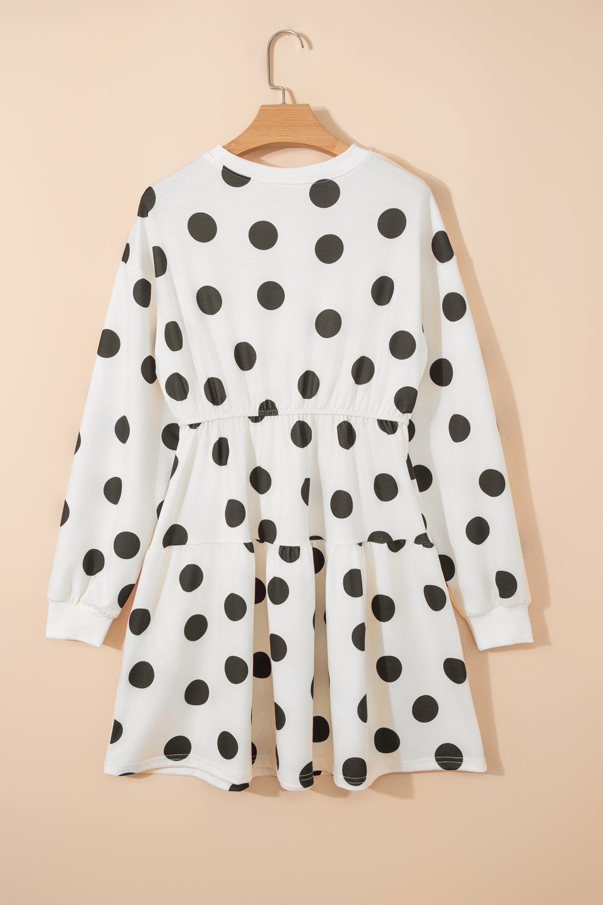 White polka dot printed long sleeve flared mini dress by Dear-Lover, featuring a fitted waist and playful pattern.
