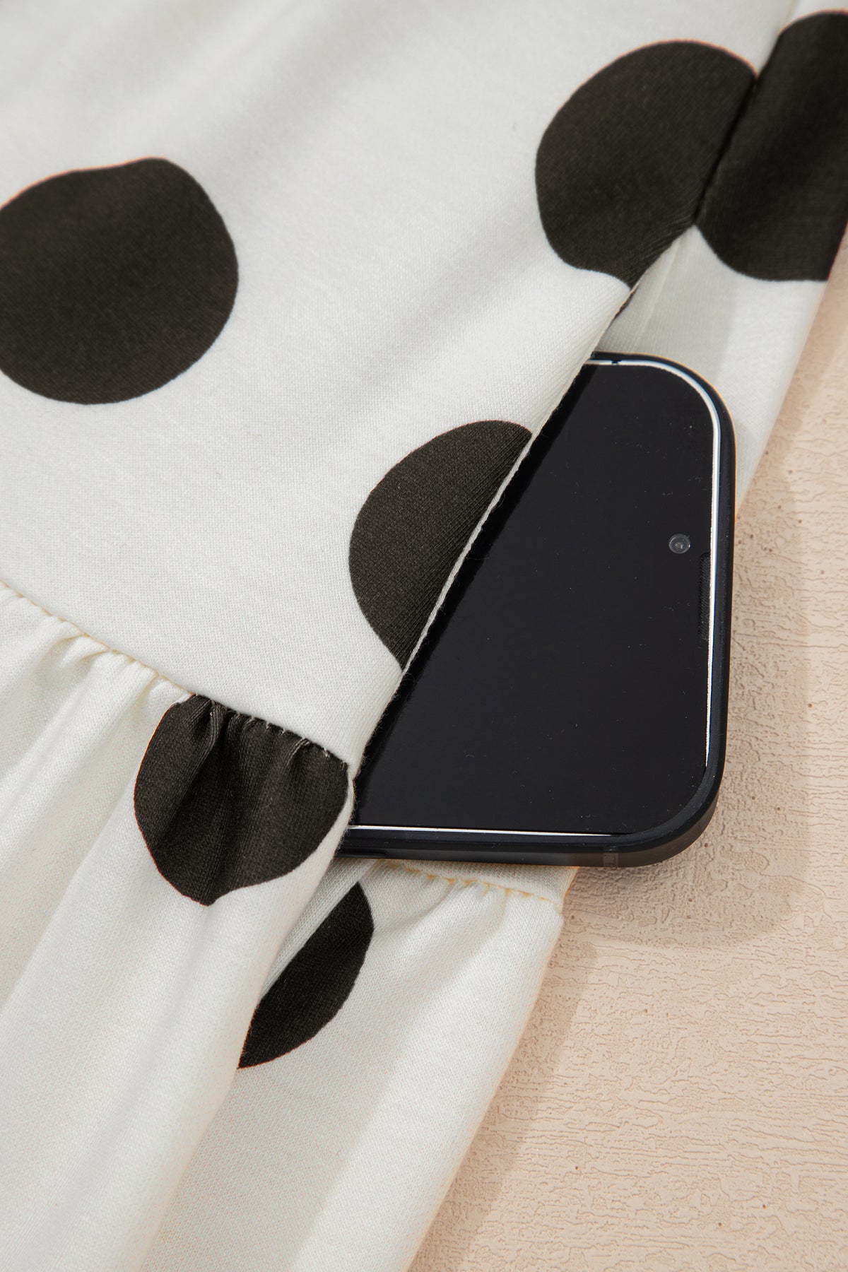 White polka dot printed long sleeve flared mini dress by Dear-Lover, stylish dress with a fitted waist and playful pattern.