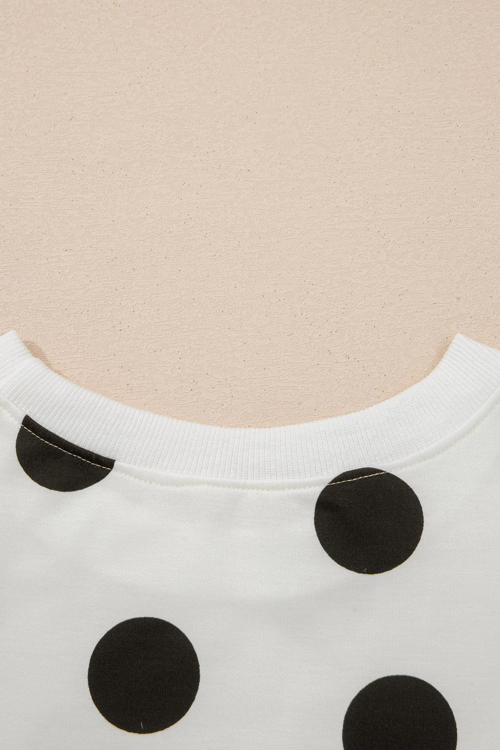 White polka dot printed long sleeve flared mini dress by Dear-Lover, featuring a fitted waist and playful pattern.