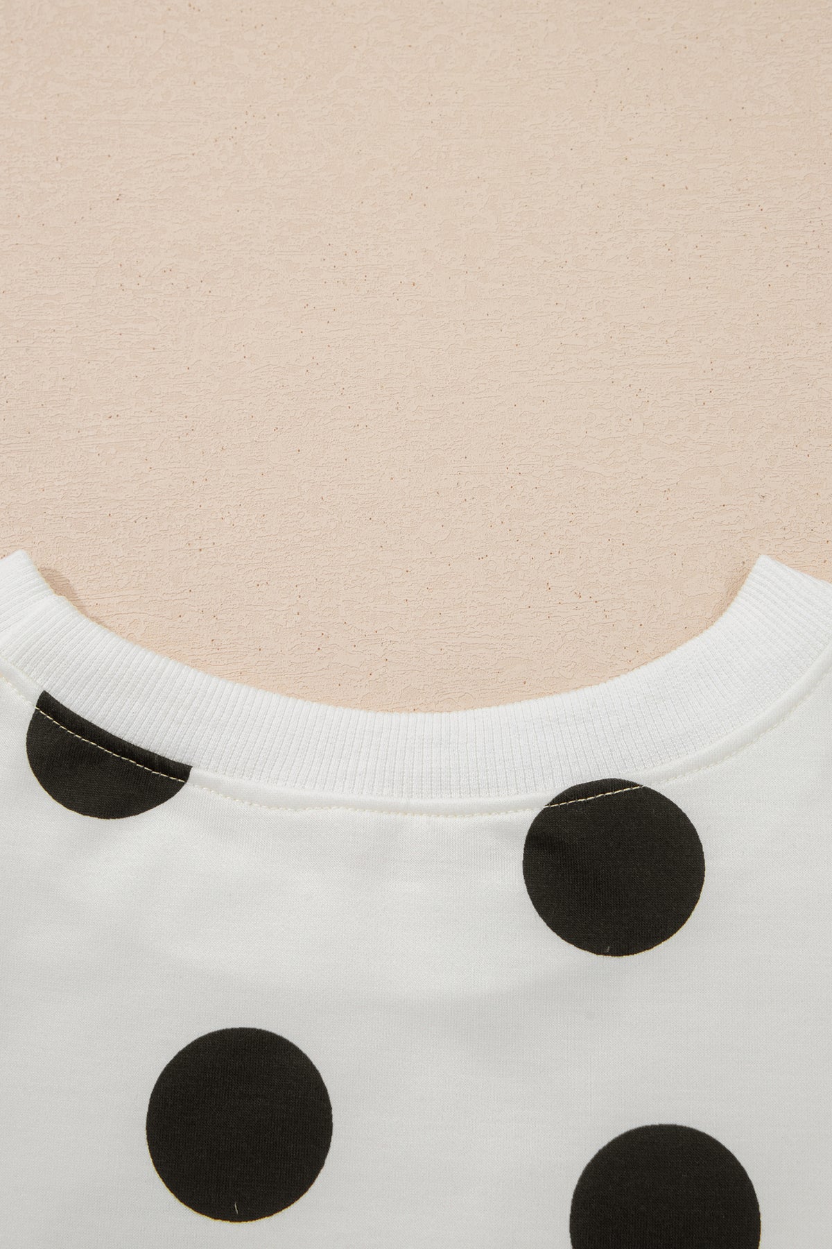 White polka dot printed long sleeve flared mini dress by Dear-Lover, featuring a fitted waist and playful pattern.