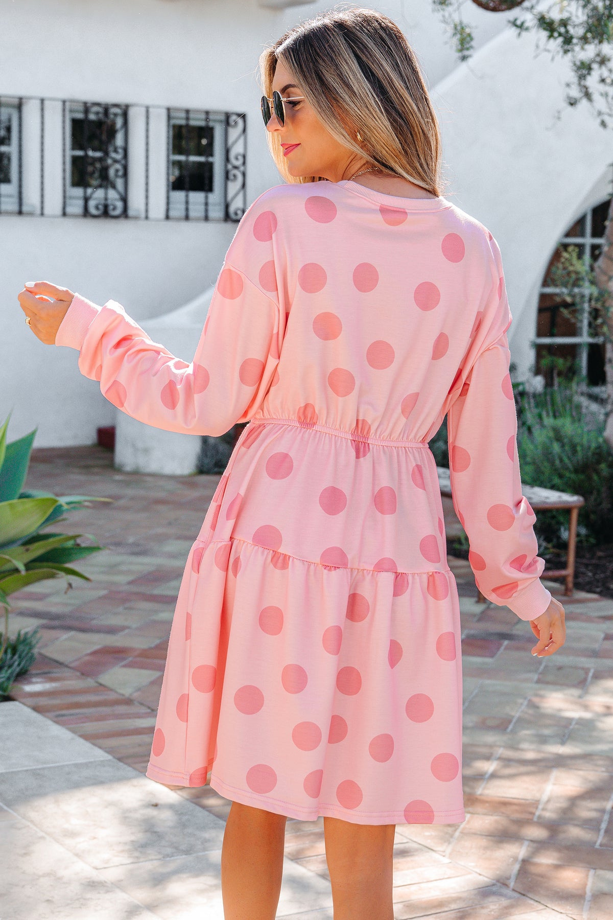 White polka dot printed long sleeve flared mini dress from Dear-Lover featuring a fitted waist and classic mini length.