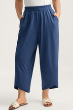 Plus size Sail Blue elastic waist capris with asymmetrical hem, loose fit, made from polyester, cotton, and elastane by Dear-Lover.