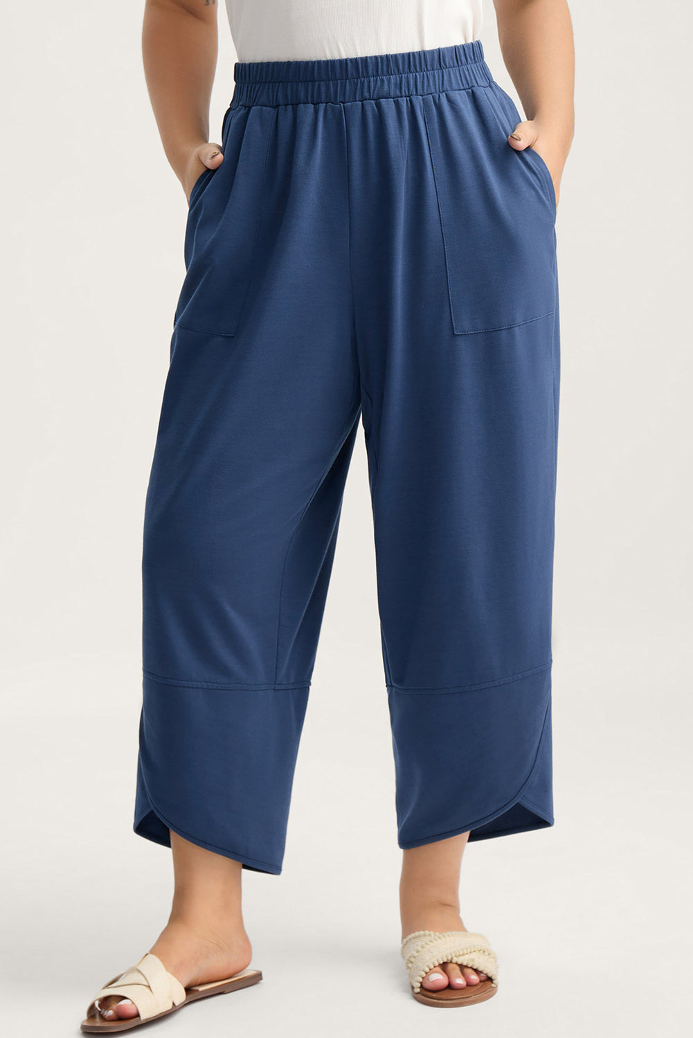 Plus size Sail Blue elastic waist capris with asymmetrical hem, loose fit, made from polyester, cotton, and elastane by Dear-Lover.