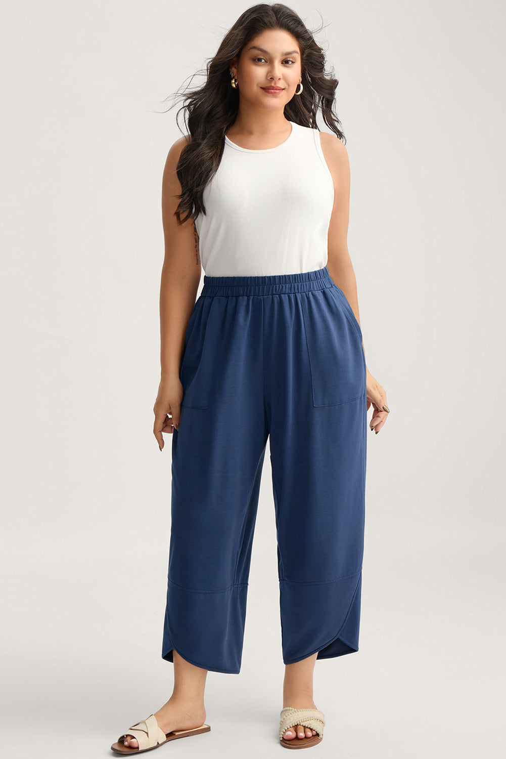 Plus size Sail Blue elastic waist asymmetrical hem loose capris pants by Dear-Lover, made of polyester, cotton, and elastane.