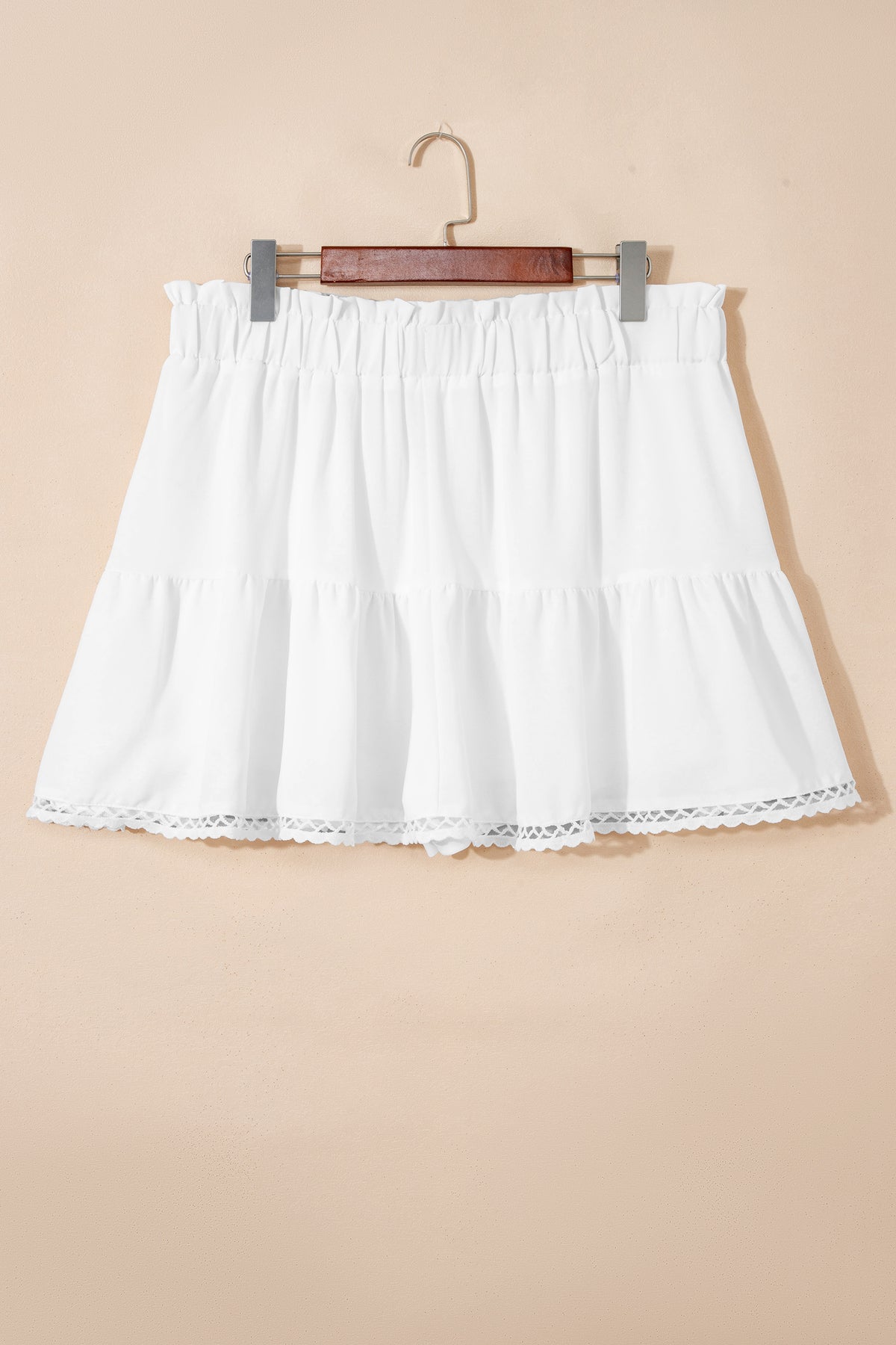 Plus size boho ruffled shorts with lace trim, elastic waist, and frilled details, ideal for relaxed, stylish summer wear.