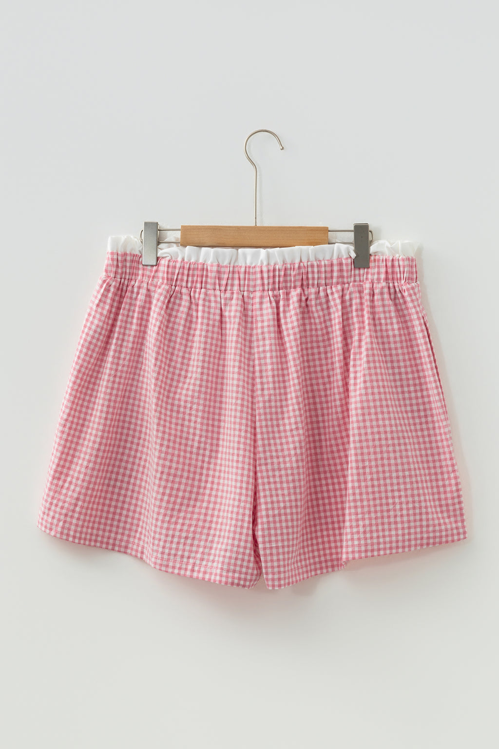 Plus size plaid print shorts with contrast trim, made of 100% cotton, featuring a comfortable fit and vibrant red design.