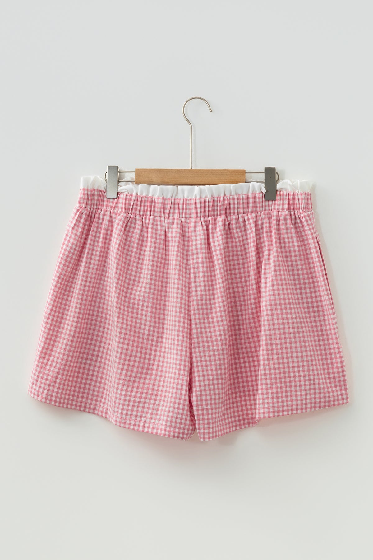 Plus size plaid print shorts with contrast trim, made of 100% cotton, featuring a comfortable fit and vibrant red design.