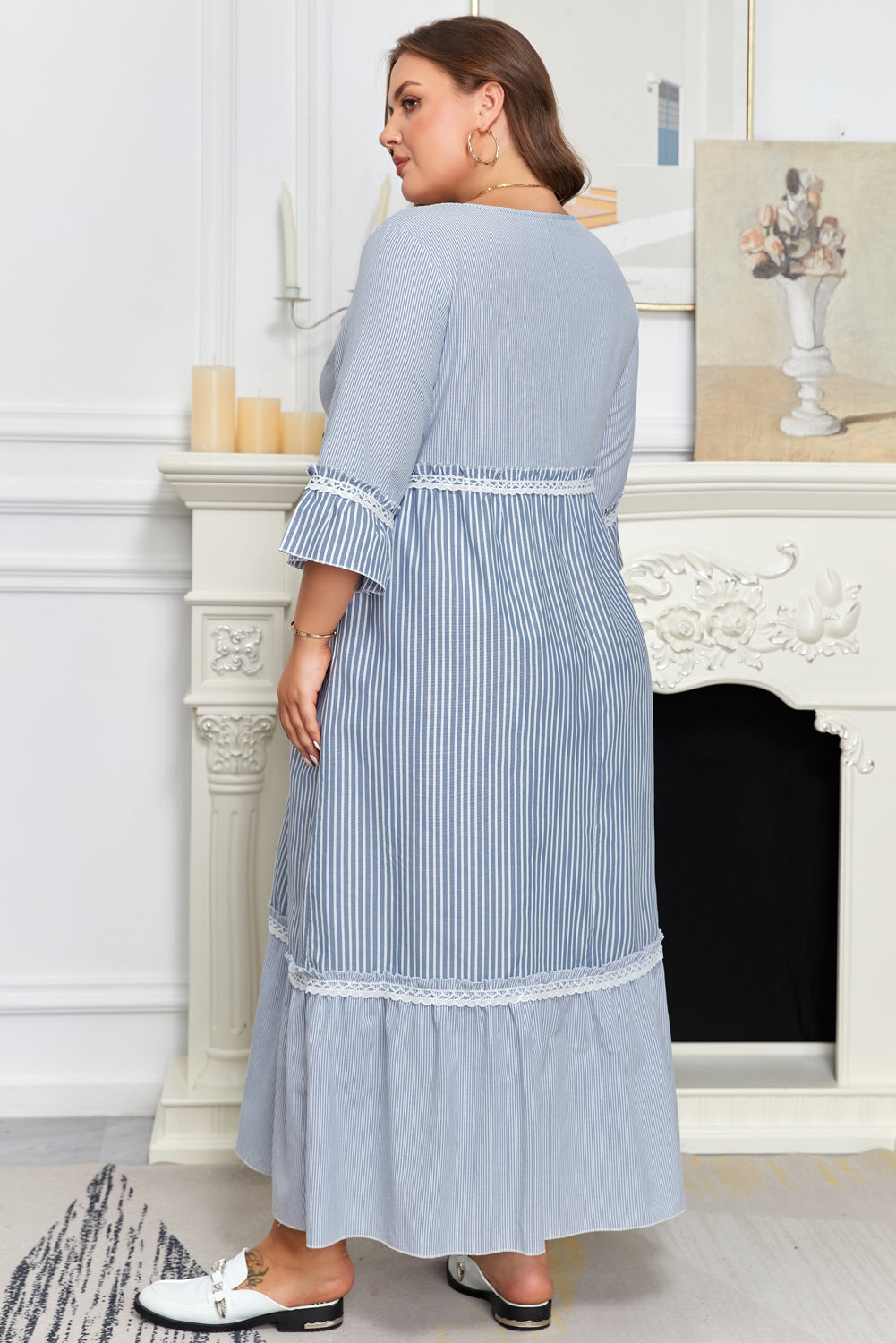 Sky blue striped plus size maxi dress with crisscross lace detail and patchwork design, made of polyester and cotton blend.