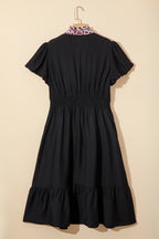 Black leopard print plus size midi dress with V-neck, patchwork design, smocked waist, and ruffled hem by Dear-Lover.