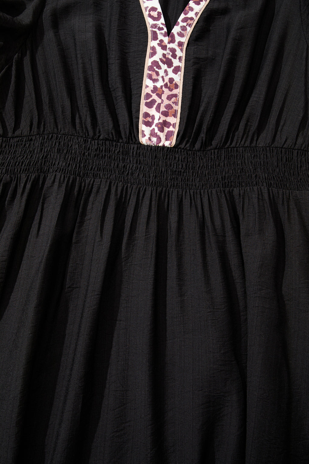 Black leopard print plus size midi dress with V-neck, patchwork design, smocked waist, and ruffled hem by Dear-Lover.