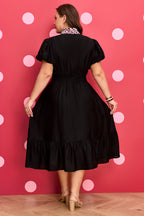 Black leopard print plus size midi dress with V-neck, patchwork design, smocked waist, and ruffled hem by Dear-Lover.