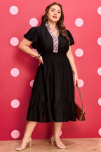 Black leopard print plus size midi dress with V-neck, patchwork design, smocked waist, and ruffled details by Dear-Lover.
