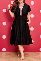Black leopard print plus size midi dress with V-neck, patchwork design, smocked waist, and ruffled hem by Dear-Lover.