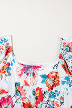 White floral plus size midi dress with square neckline, puff sleeves, and flowy fabric, perfect for stylish occasions.