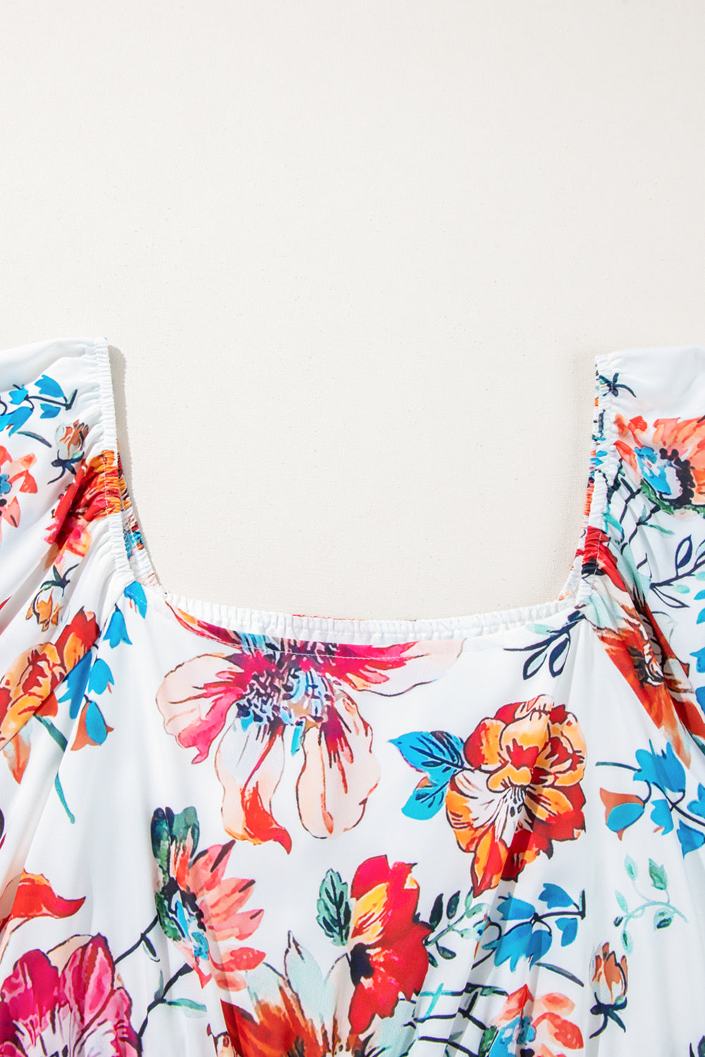 White floral plus size midi dress with square neckline, puff sleeves, and flowy fabric, perfect for stylish occasions.