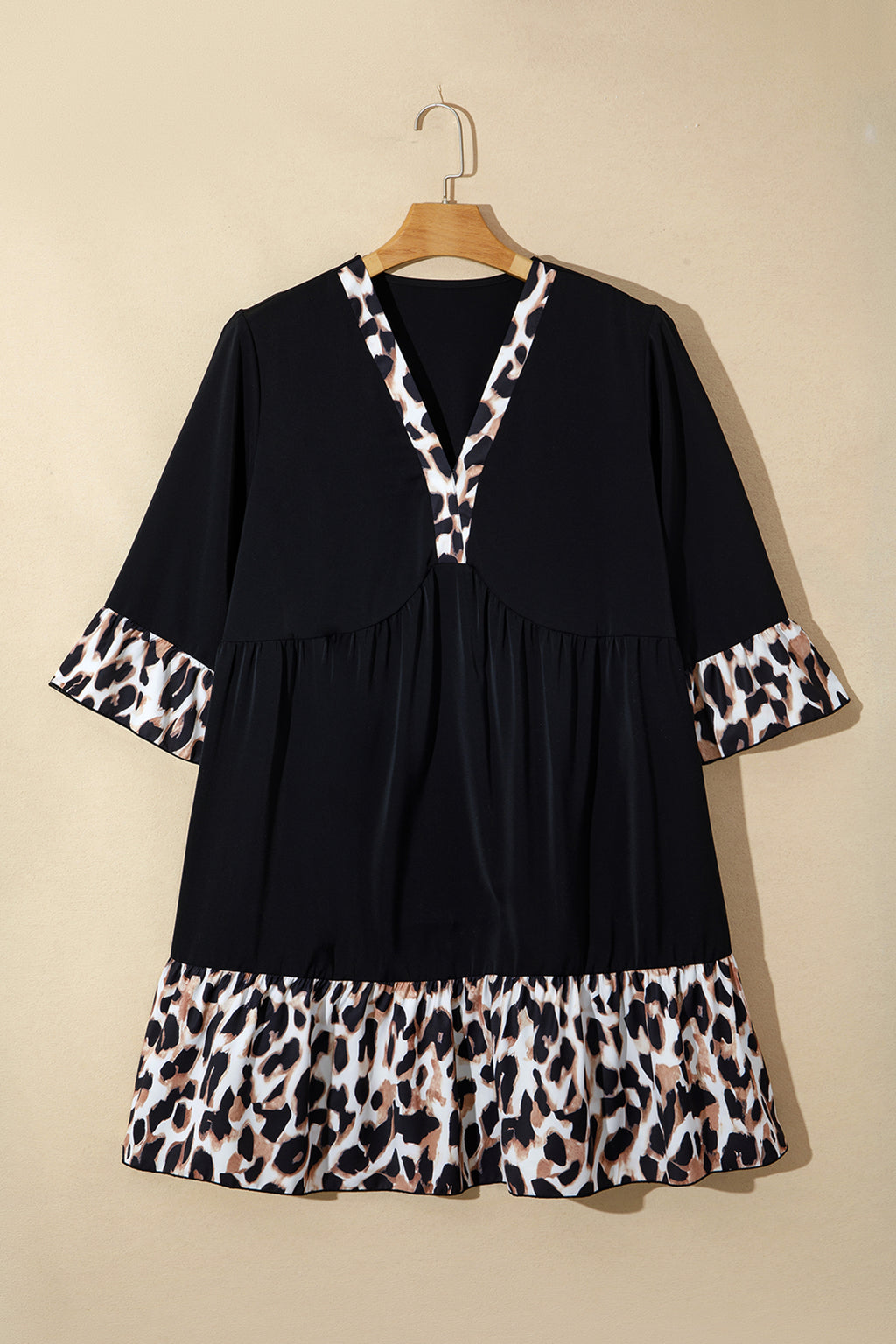 Black plus size leopard patchwork mini dress with V-neck, 3/4 sleeves, and ruffle hem by Dear-Lover, perfect for casual wear.
