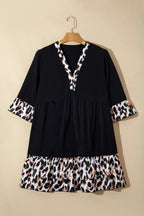 Black plus size leopard patchwork mini dress with V-neck, 3/4 sleeves, and ruffle hem by Dear-Lover, perfect for casual wear.