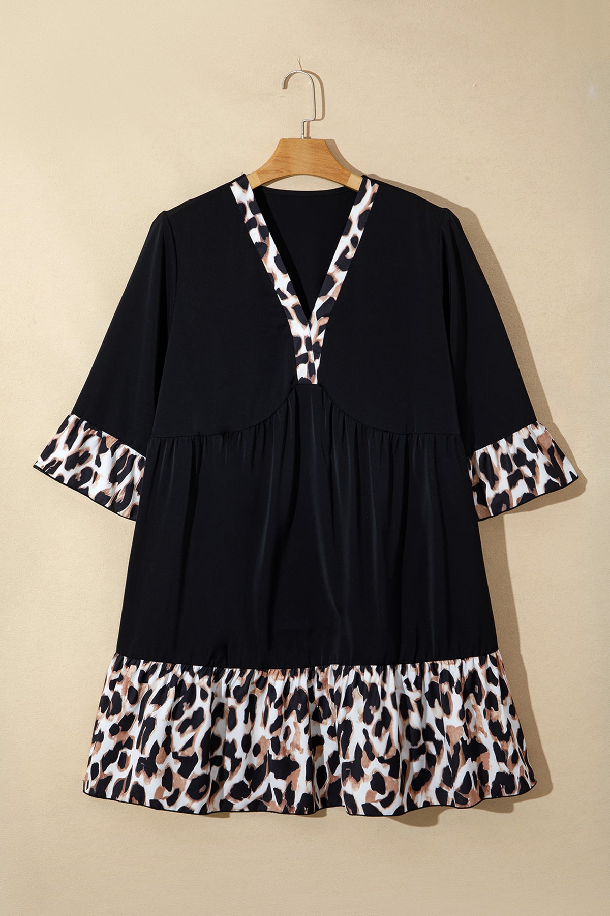 Black plus size leopard patchwork mini dress with V-neck, 3/4 sleeves, and ruffle hem by Dear-Lover, perfect for casual wear.