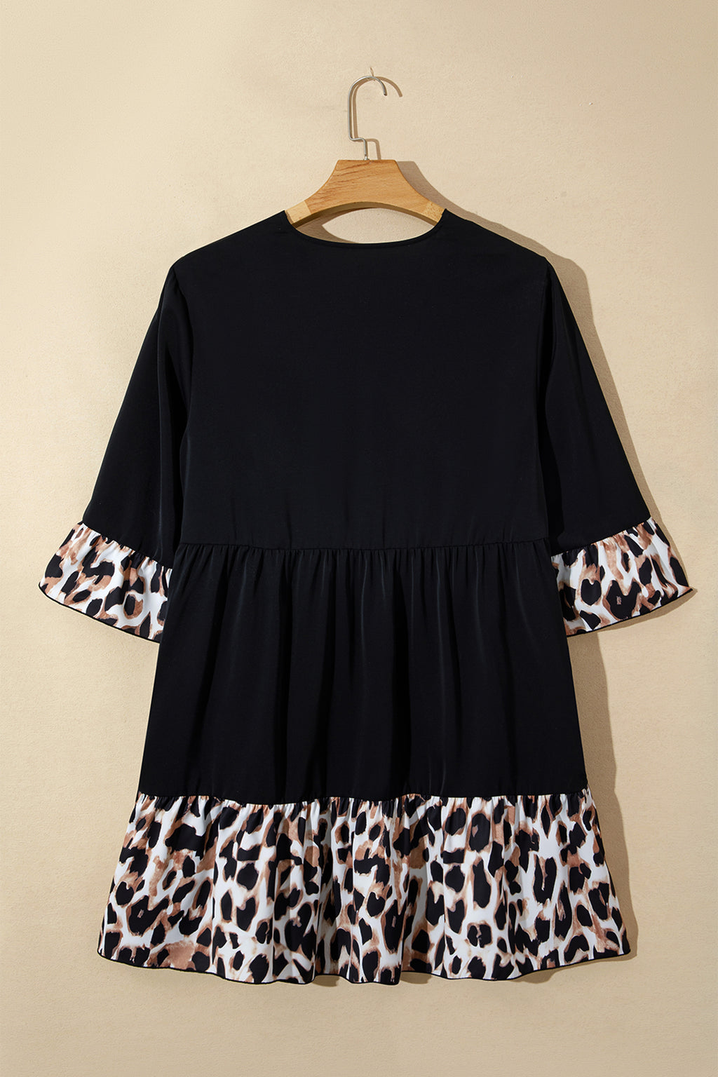 Black plus size leopard patchwork mini dress with V-neck, 3/4 sleeves, and ruffle hem from Dear-Lover.