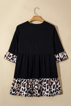 Black plus size leopard patchwork mini dress with V-neck, 3/4 sleeves, and ruffle hem from Dear-Lover.