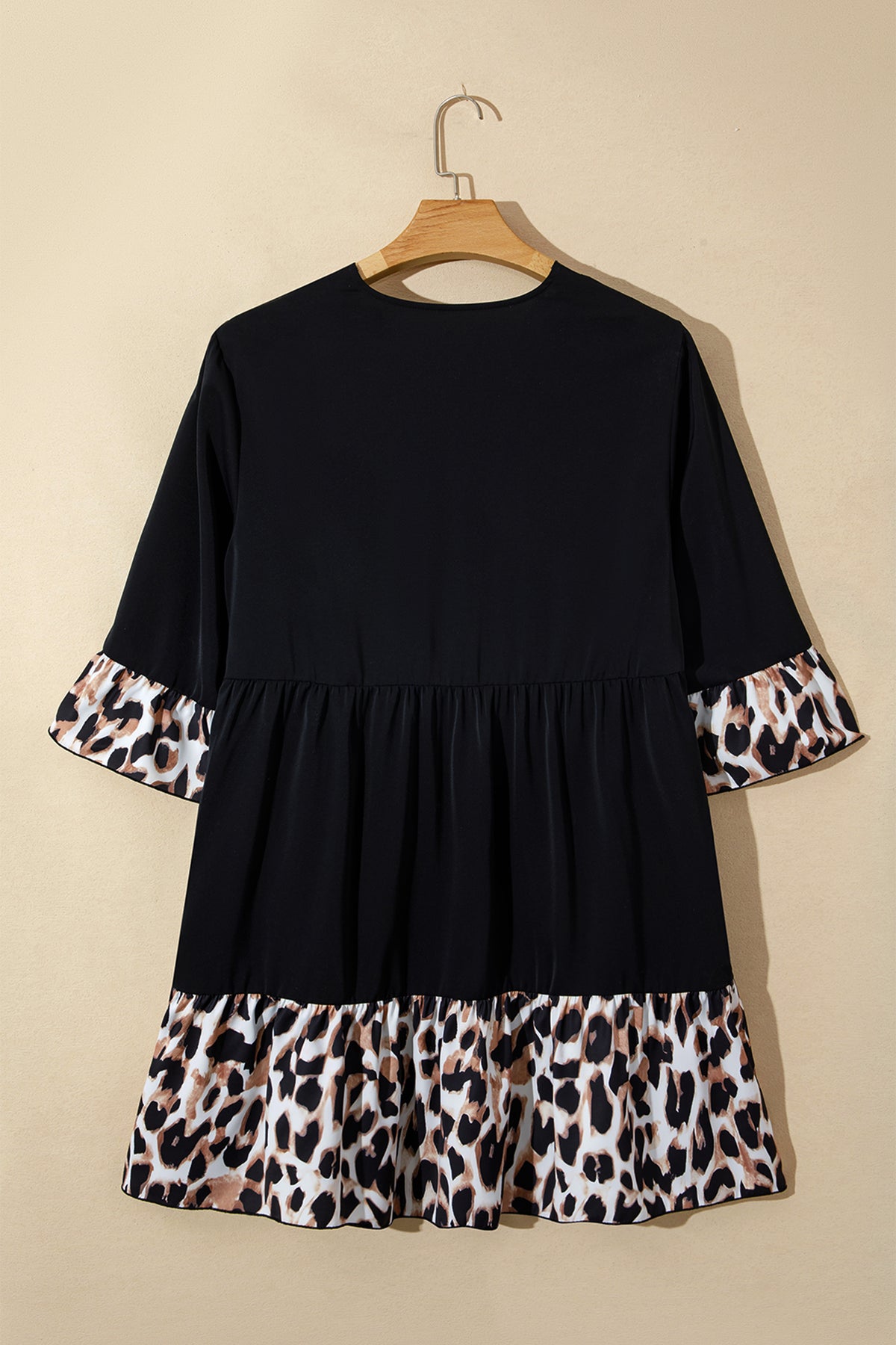 Black plus size leopard patchwork mini dress with V-neck, 3/4 sleeves, and ruffle hem from Dear-Lover.