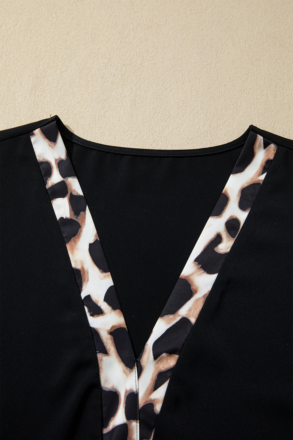 Black plus size leopard patchwork mini dress with V-neck, 3/4 sleeves, ruffle hem, from Dear-Lover Plus Size Dresses collection.