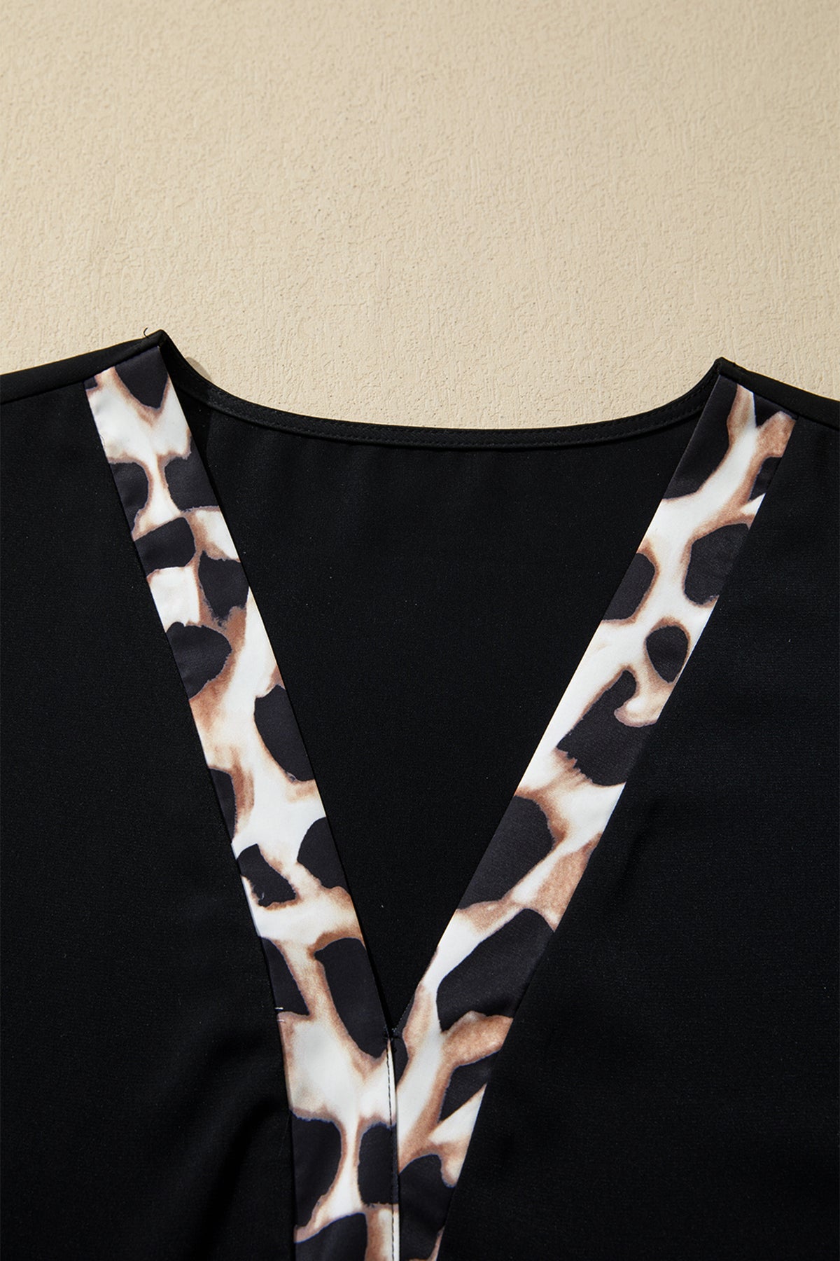 Black plus size leopard patchwork mini dress with V-neck, 3/4 sleeves, ruffle hem, from Dear-Lover Plus Size Dresses collection.