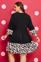 Black plus size leopard patchwork mini dress with V-neck, 3/4 sleeves, and ruffle hem, by Dear-Lover.