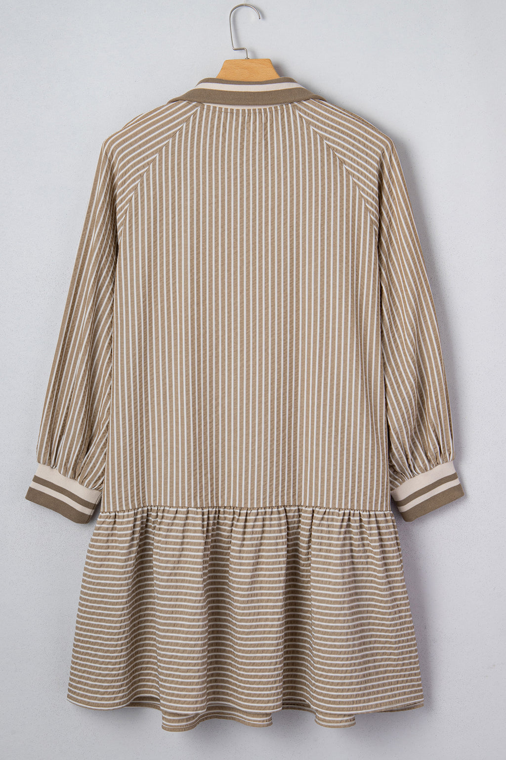 Khaki stripe plus size mini dress with zip-up collar, puff sleeves, and ruffled details, made of polyester and cotton blend.