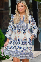 Sky blue plus size boho print mini dress with split neck and long sleeves, from Dear-Lover, made of viscose and polyamide fabric.