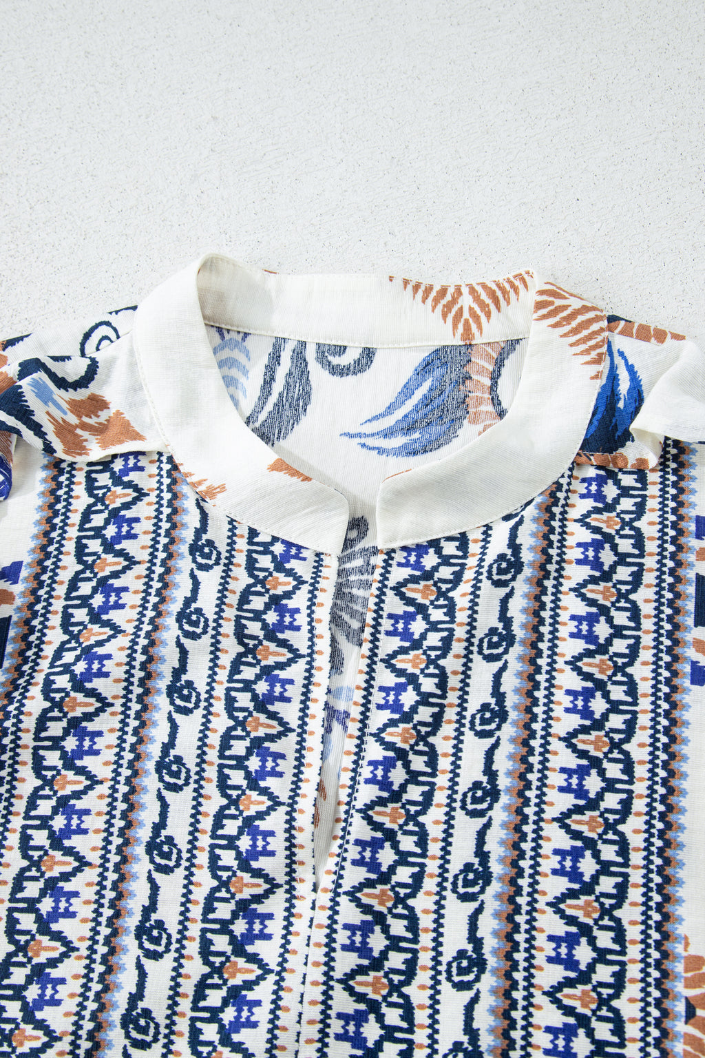 Sky blue plus size boho print mini dress with split neck and long sleeves, made of viscose and polyamide, by Dear-Lover.