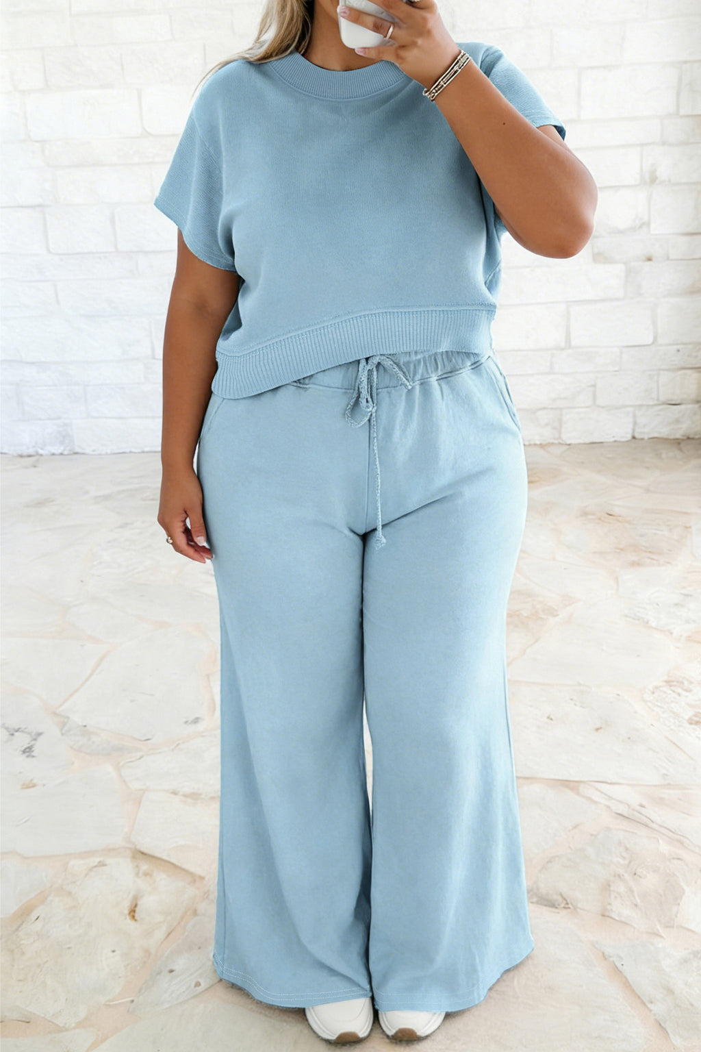 Plus size Mist Blue loungewear set with ribbed trim short sleeve top and drawstring loose pants, made of polyester and cotton blend.