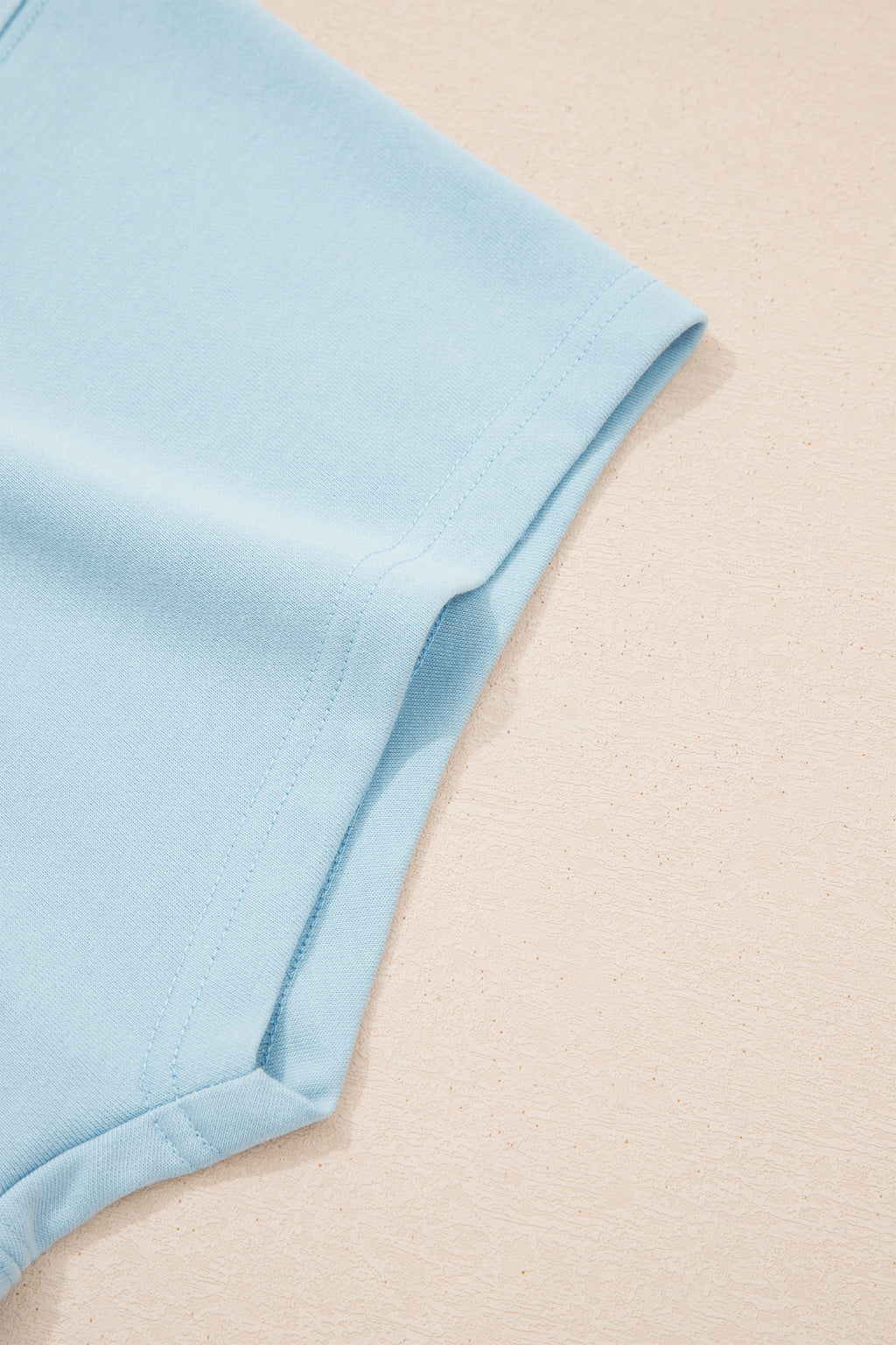 Plus size Mist Blue loungewear set with ribbed trim short sleeve top and drawstring loose pants, made of polyester and cotton blend.