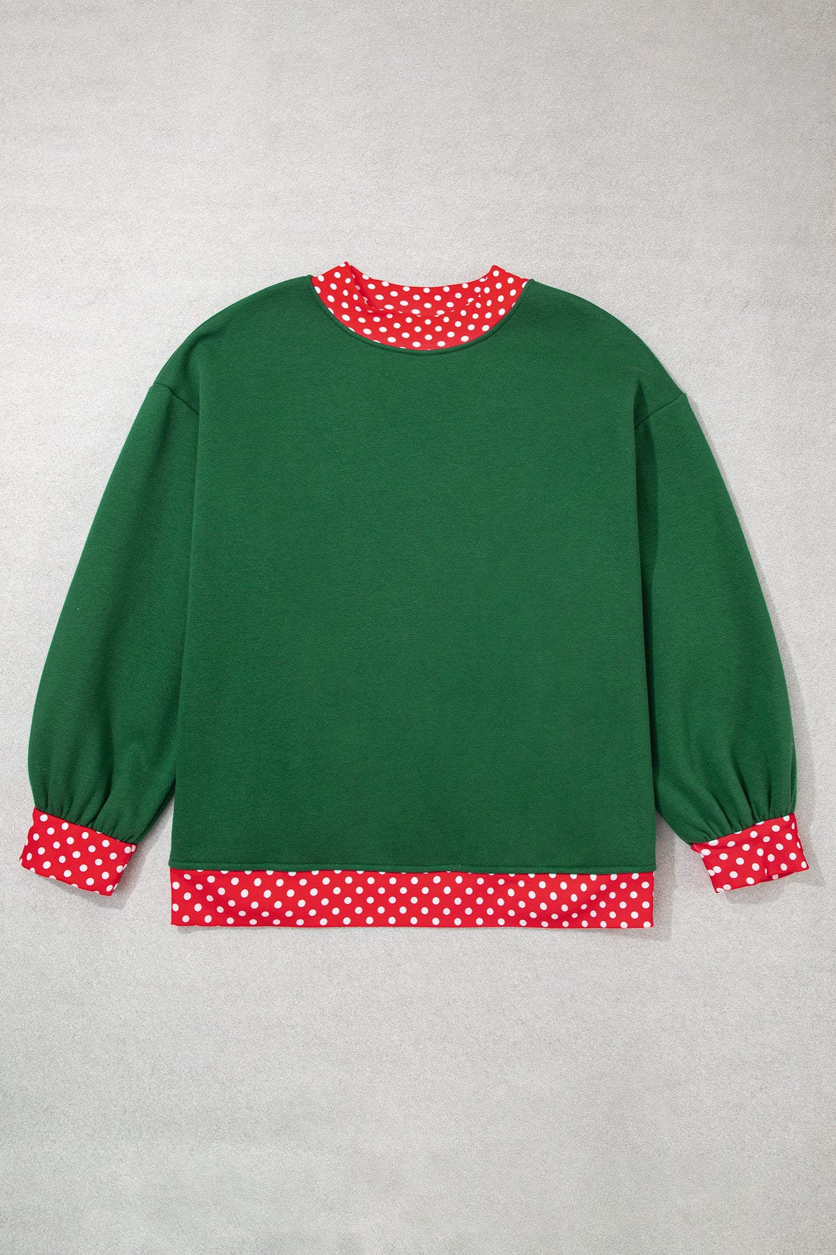 Red plus size sweatshirt with polka dot patchwork design and round neckline, featuring a comfortable fit and casual style.