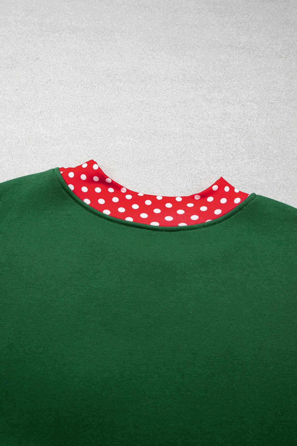 Red plus size sweatshirt with polka dot patchwork design and round neckline, featuring a cozy fit and casual style.